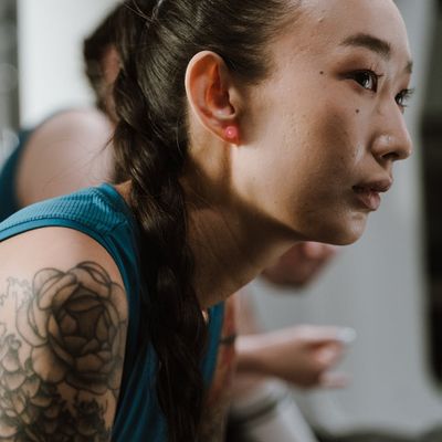 Close-up of a person's focused expression during a workout.